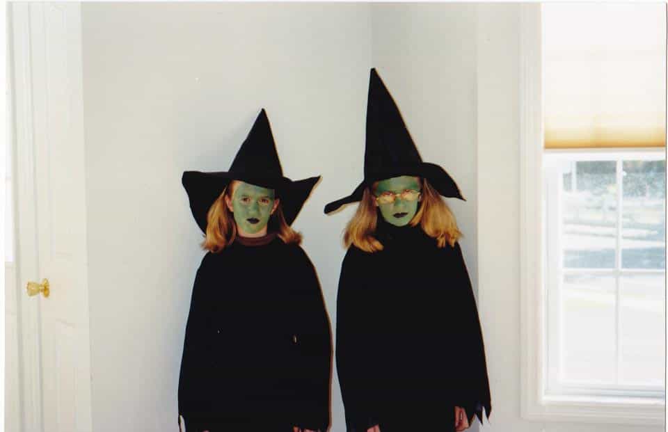 Brittany and Janel dressed as witches on Halloween when young
